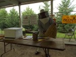 Herb Lester shows 2nd graders how the North American Settlers kept Black German Bees in Skeps