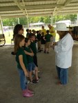 Beekeeper talks to Wilson County 2nd Graders one-on-one about the importance of honeybee to pollination to our fruit and vegetable plants