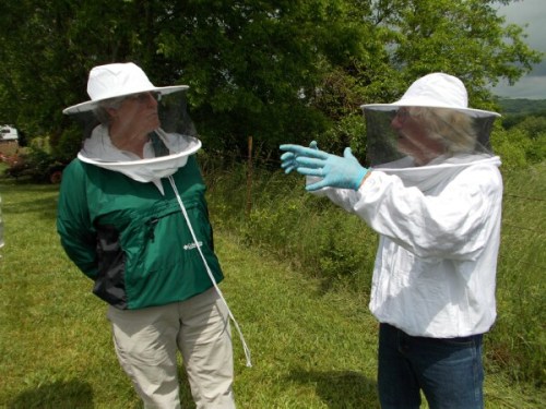 Carey shows Ruth how to choke a bear if you catch one in your hives.